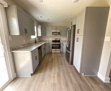 Complete luxury vinyl plank flooring in home kitchen